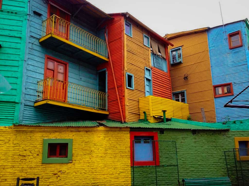closeup of wooden houses in la boca in Buenos Aires in Argentina. the houses are painted different bright colours that don